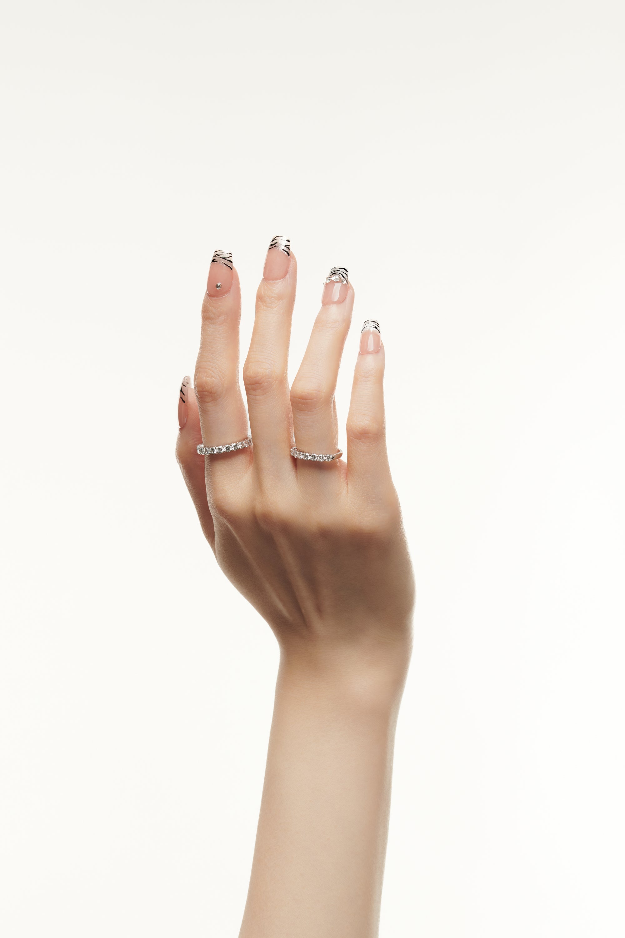 Wild Card / No.16 – Glossy Nude Base with Shimmer Zebra Tips and Crystal Accents